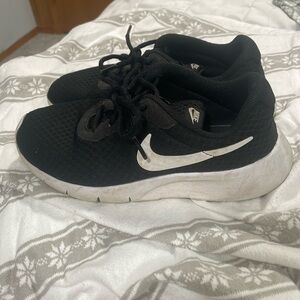 Girls Nike black and white running shoes